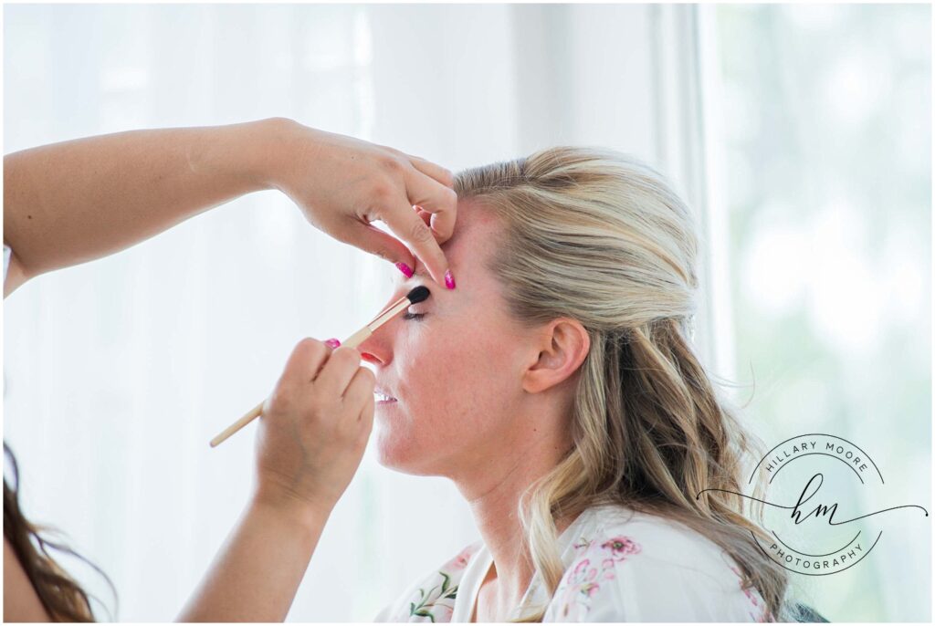 woman getting her makeup done for her wedding