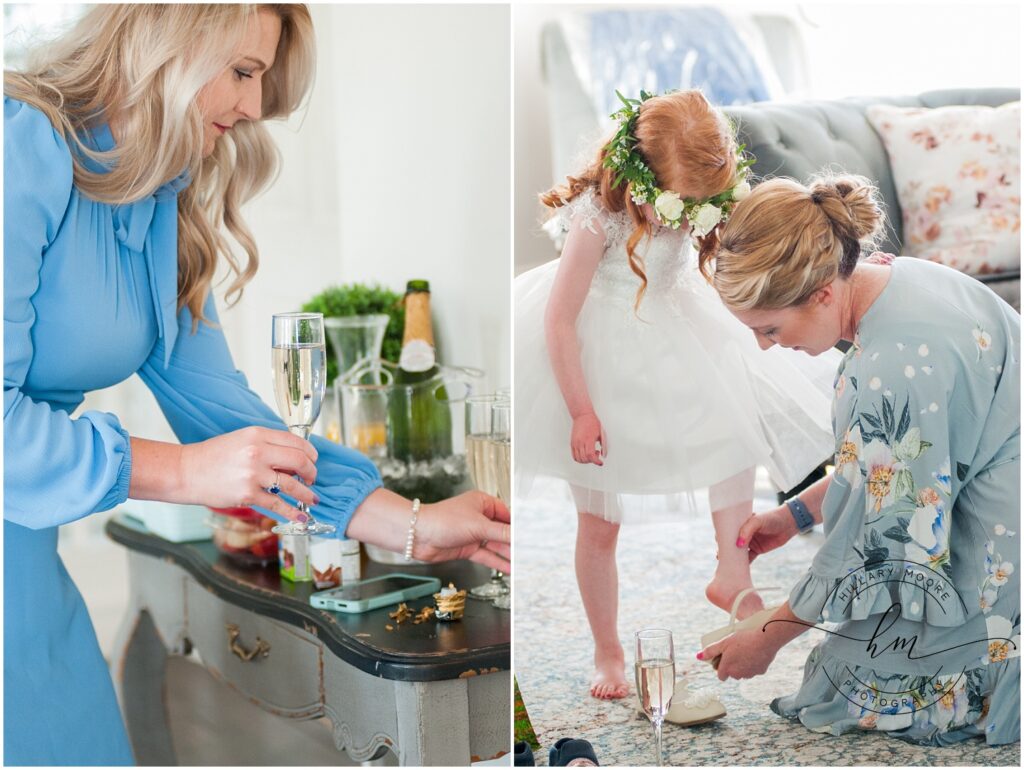 woman with champagne glasses and a little girl putting her shoes on