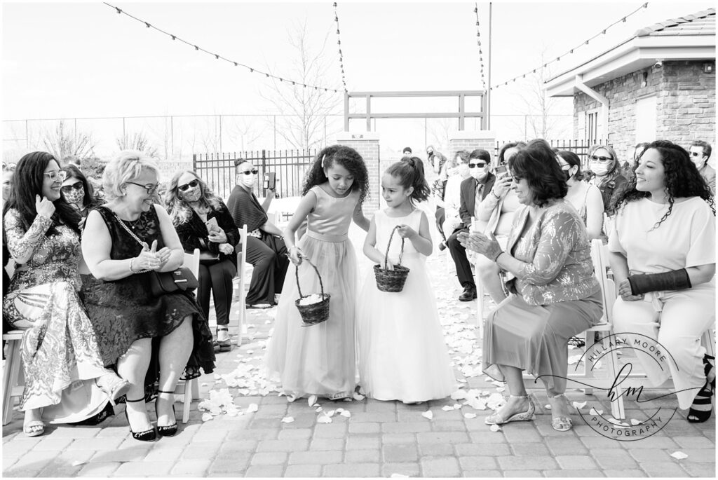 Flower girls walking down the aisle