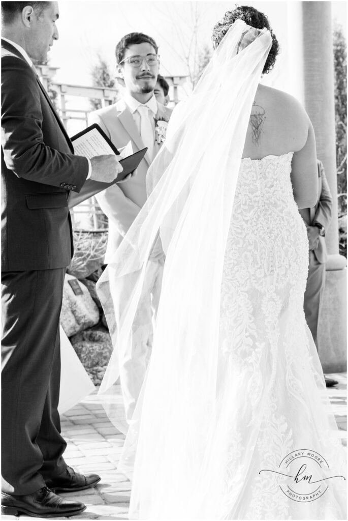 Bride and groom at the altar with officiant.