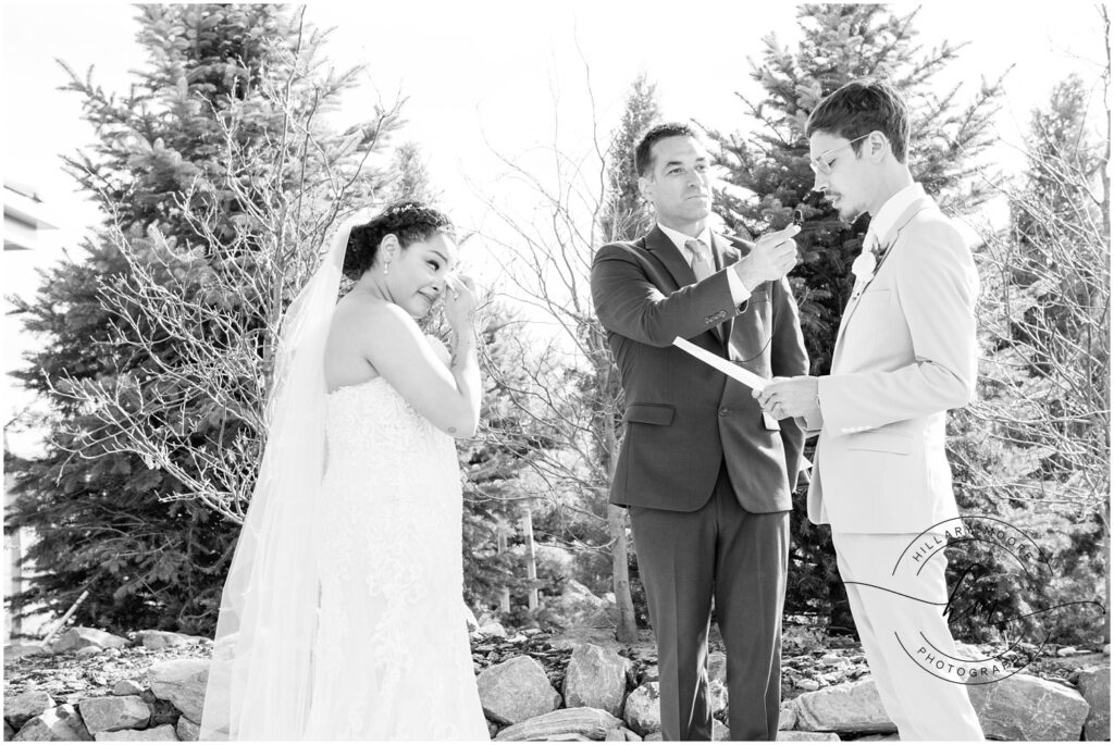 Groom reading his vows to the bride.