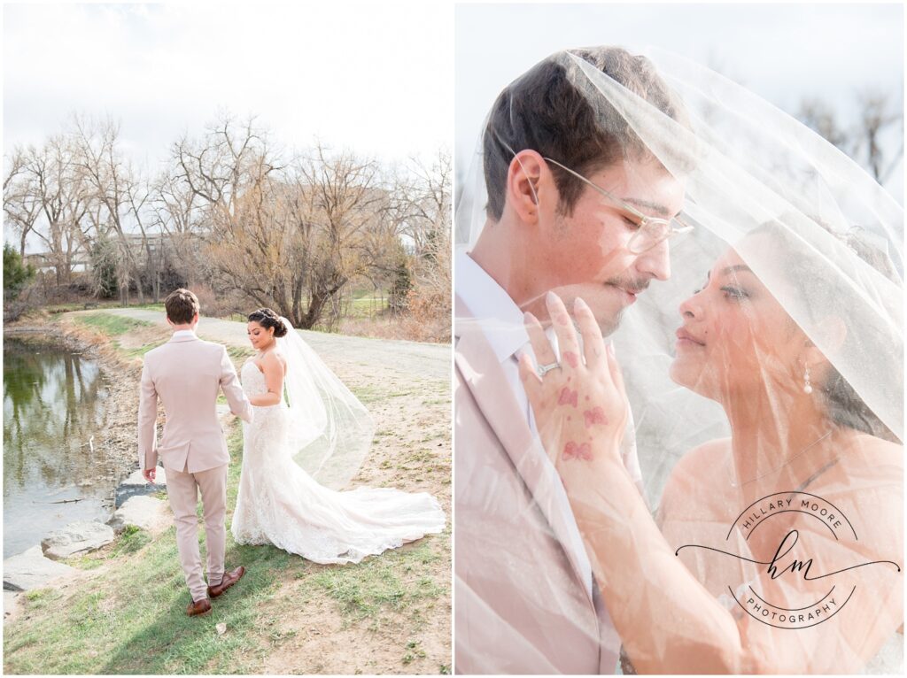 Bride and groom together by a pond.