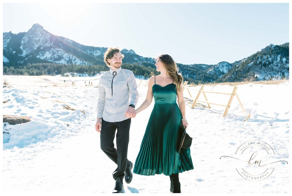 couple walking in snowy field