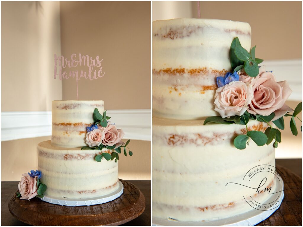 The wedding cake which is frosted with white and flowers.