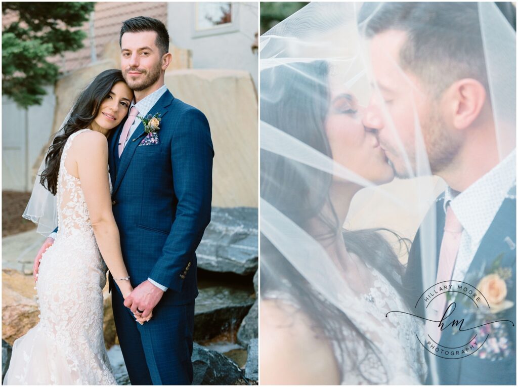 The bride and groom kissing behind the veil.